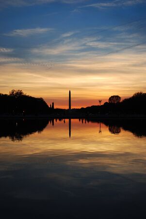 Washington monument sunset with lake reflection silhouette panorama, Washington DCの写真素材