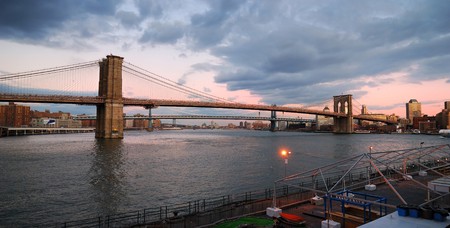 New York City Brooklyn Bridge with Manhattan skyline panorama at sunsetの写真素材