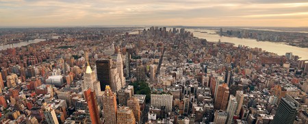 New York City Manhattan sunset skyline panorama aerial view with office building skyscrapers and...
