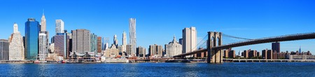 New York City Manhattan skyline panorama with Brooklyn Bridge and skyscrapers over Hudson River in the morning after sunrise.の写真素材