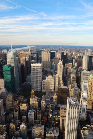 New York City Manhattan sunset skyline aerial view with office building skyscrapers and blue sky.の写真素材