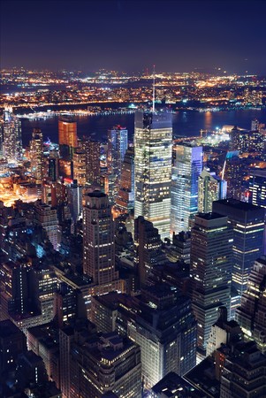 New York City Manhattan Times Square panorama aerial view at night with office building skyscrapers skyline illuminated by Hudson River.の写真素材