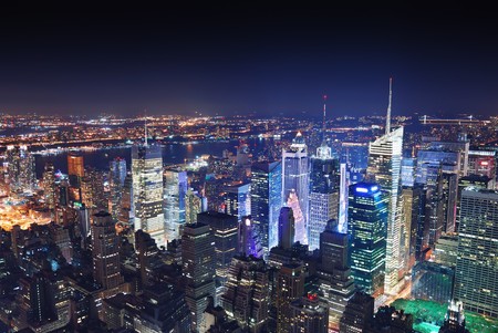 New York City Manhattan Times Square panorama aerial view at night with office building skyscrapers skyline illuminated by Hudson River.の写真素材