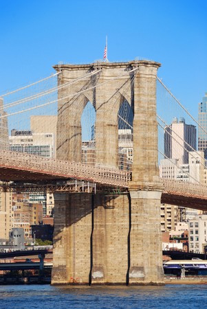 New York City Brooklyn Bridge in Manhattan closeup with skyscrapers and city skyline over Hudson River.の写真素材