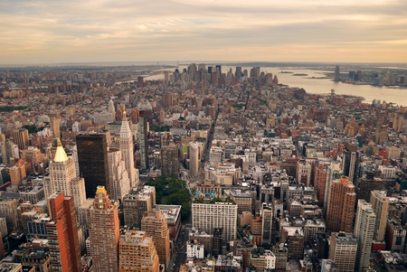 New York City Manhattan sunset skyline aerial view with office building skyscrapers and Hudson River.の写真素材