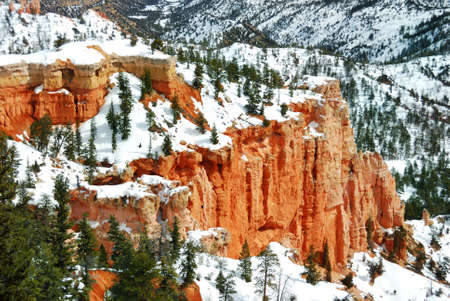 Bryce canyon panorama with snow in Winter with red rocks and blue sky. の写真素材