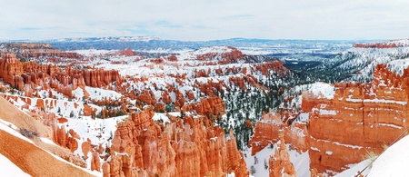 Bryce canyon panorama with snow in Winter with red rocks and blue sky. の写真素材