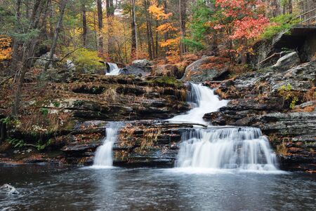 Waterfall with trees and rocks in mountain in Autumn. From Pennsylvania Dingmans Falls.の写真素材