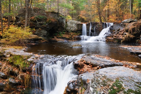 Waterfall with trees and rocks in mountain in Autumn. From Pennsylvania Dingmans Falls.の写真素材