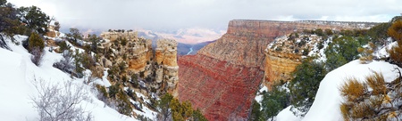 Grand Canyon panorama view in winter with snow and clear blue sky.の写真素材