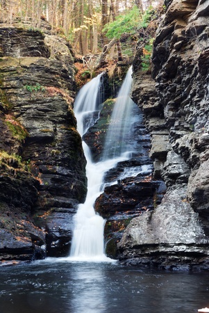 Waterfall with trees and rocks in mountain in Autumn. From Fulmer Falls Pennsylvania Dingmans Falls.の写真素材