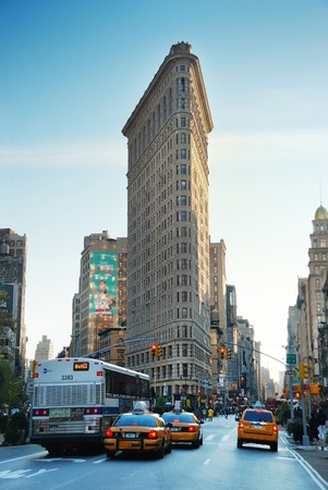 NEW YORK CITY - DEC 7: Flat Iron building, considered to be one of the first skyscrapers ever built, with New York City street view. December 7, 2009 in Manhattan, New York City. のeditorial素材