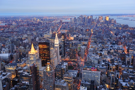 New York City Manhattan downtown aerial view at dusk with urban city skyline and skyscrapers buildingsの写真素材