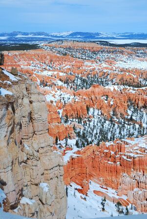 Bryce canyon panorama with snow in Winter with red rocks and blue sky. の写真素材