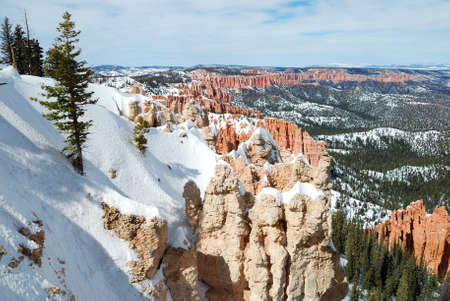 Bryce canyon panorama with snow in Winter with red rocks and blue sky. の写真素材