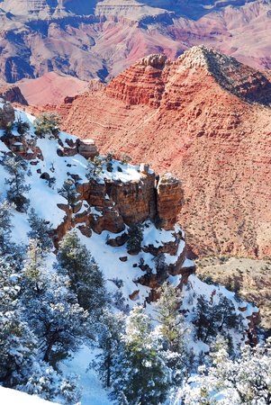 Grand Canyon panorama view in winter with snow and clear blue sky.の写真素材