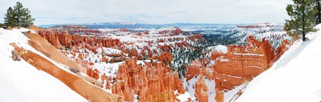 Bryce canyon panorama with snow in Winter with red rocks and blue sky. の写真素材