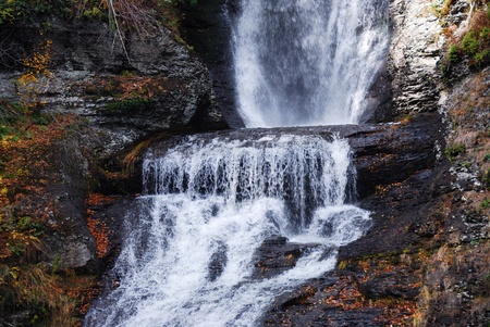 Waterfall in Autumn mountain with woods, foliage and rocks. From Digmans Fall of Pennsylvaniaの写真素材