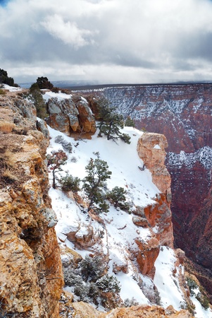 Grand Canyon panorama view in winter with snow and clear blue sky.の写真素材