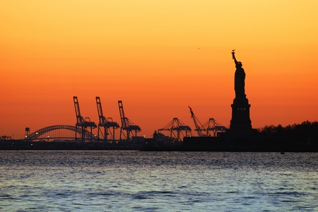 New York City Manhattan Statue of Liberty silhouette at sunset.の写真素材