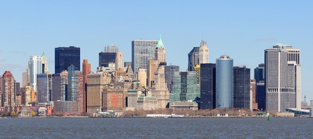 New York City Manhattan downtown district skyline panorama with skyscrapers over river with blue clear sky. の写真素材