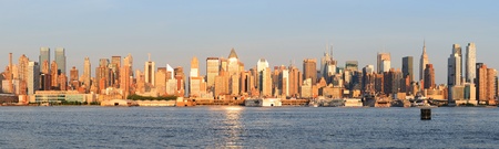 New York City Manhattan midtown skyline panorama at sunset.の写真素材