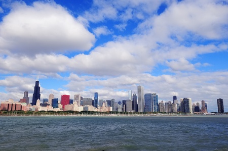 Chicago skyline panorama with skyscrapers over Lake Michigan with cloudy blue sky.のeditorial素材