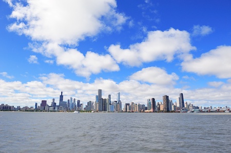Chicago city urban skyline with skyscrapers over Lake Michigan with cloudy blue sky.のeditorial素材