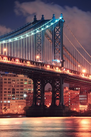 Manhattan Bridge closeup over East River at night in New York City Manhattan with lights and reflections.のeditorial素材