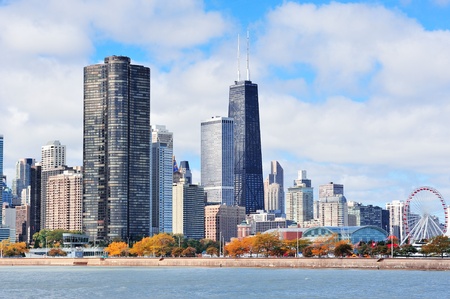 Chicago city urban skyline with skyscrapers over Lake Michigan with cloudy blue sky.の写真素材