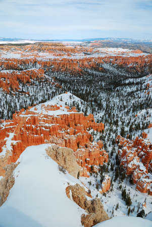 Bryce canyon panorama with snow in Winter with red rocks and blue sky. の写真素材