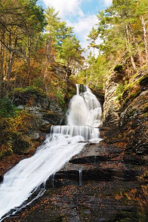 Waterfall in Autumn mountain with woods, foliage and rocks. From Digmans Fall of Pennsylvaniaの写真素材