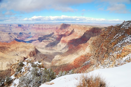 Grand Canyon panorama view in winter with snow and clear blue sky.の写真素材