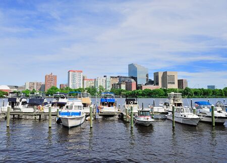 Boston Charles River with urban city skyline Hancock building and boats with blue sky.のeditorial素材