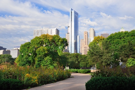 Chicago city downtown urban skyline with skyscrapers and cloudy blue sky over park.の写真素材