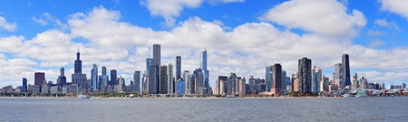 Chicago city urban skyline panorama with skyscrapers over Lake Michigan with cloudy blue sky.の写真素材