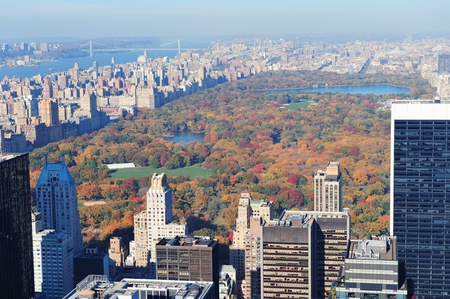 New York City skyscrapers in midtown Manhattan aerial panorama view in the day with Central Park and colorful foliage in Autumn.の写真素材