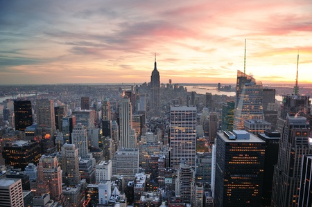 New York City skyline aerial view at sunset with colorful cloud and skyscrapers of midtown Manhattan.のeditorial素材