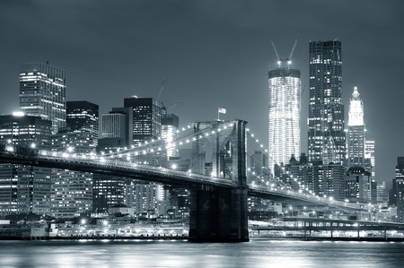 New York City Brooklyn Bridge black and white with downtown skyline over East River.のeditorial素材