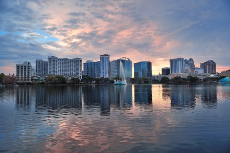 Orlando Lake Eola sunset with urban architecture skyline and colorful cloudの写真素材