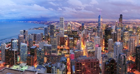 Chicago skyline panorama aerial view with skyscrapers over Lake Michigan with cloudy  sky at dusk 