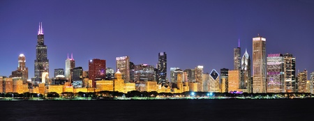 Chicago city downtown urban skyline panorama at dusk with skyscrapers over Lake Michigan with clear blue sky の写真素材