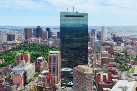 Boston downtown skyline aerial view with modern skyscrapers and street.