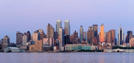 New York City Manhattan sunset panorama with historical skyscrapers over Hudson River viewed from New Jersey Weehawken waterfront at dusk with tranquil blue tone. のeditorial素材