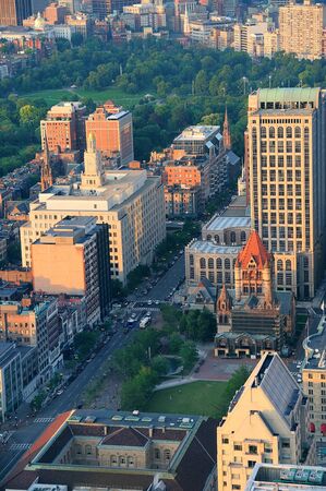 Boston city downtown aerial view with urban historical buildings at sunset.の写真素材