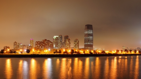 New Jersey skyline at night with skyscrapers over Hudson River の写真素材