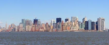 New York City Manhattan downtown district skyline panorama with skyscrapers over river with blue clear sky  の写真素材