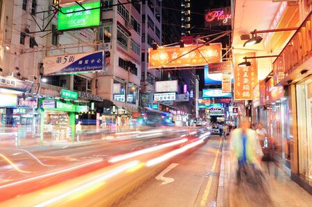 HONG KONG, CHINA - APR 23: Crowded street view at night on April 23, 2012 in Hong Kong, China. With 7M population and land mass of 1104 sq km, it is one of the most dense areas in the world.のeditorial素材