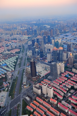 Shanghai aerial view at sunset with urban skyscrapers over riverのeditorial素材