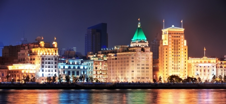 Shanghai historic architecture at night lit by lights over Huangpu Riverのeditorial素材